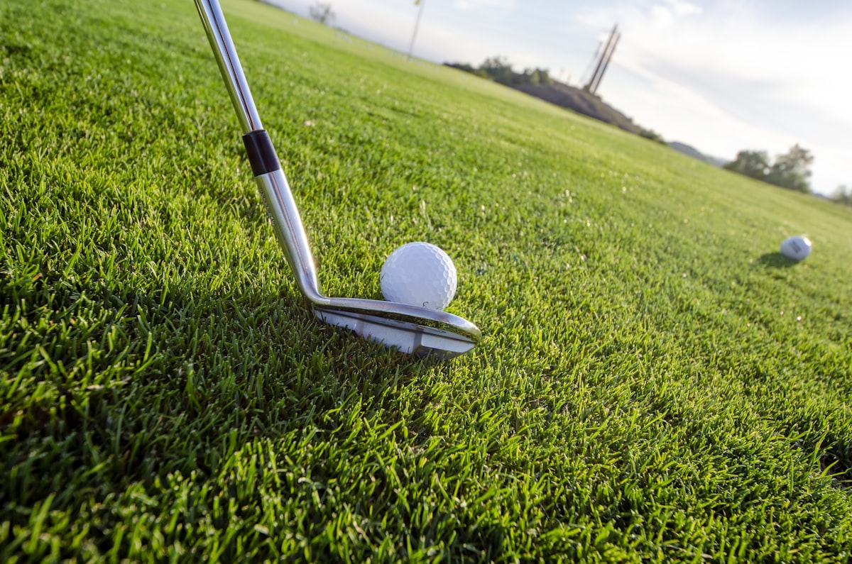 Club striking a golf ball