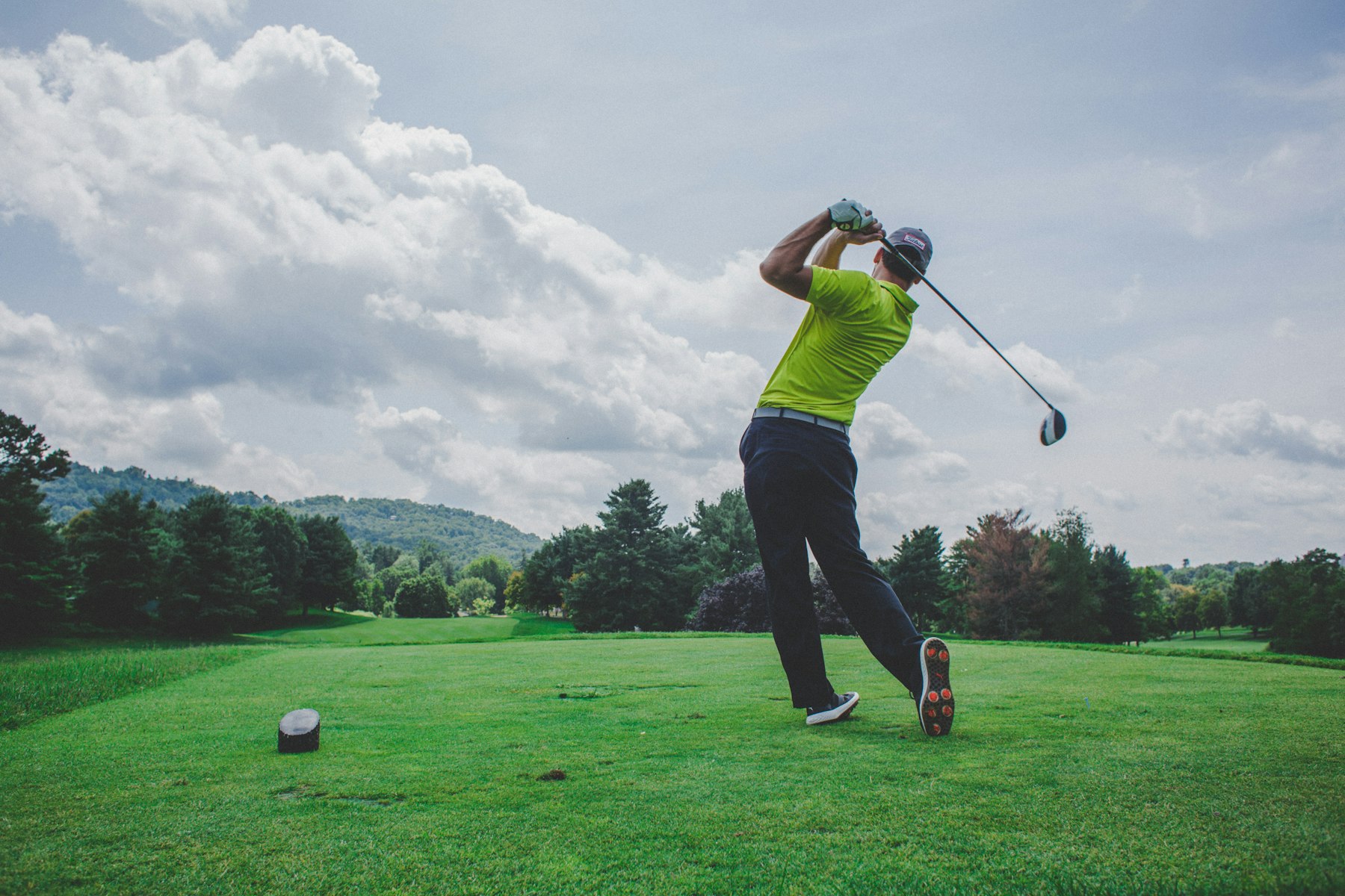 Golfer finishing a powerful swing