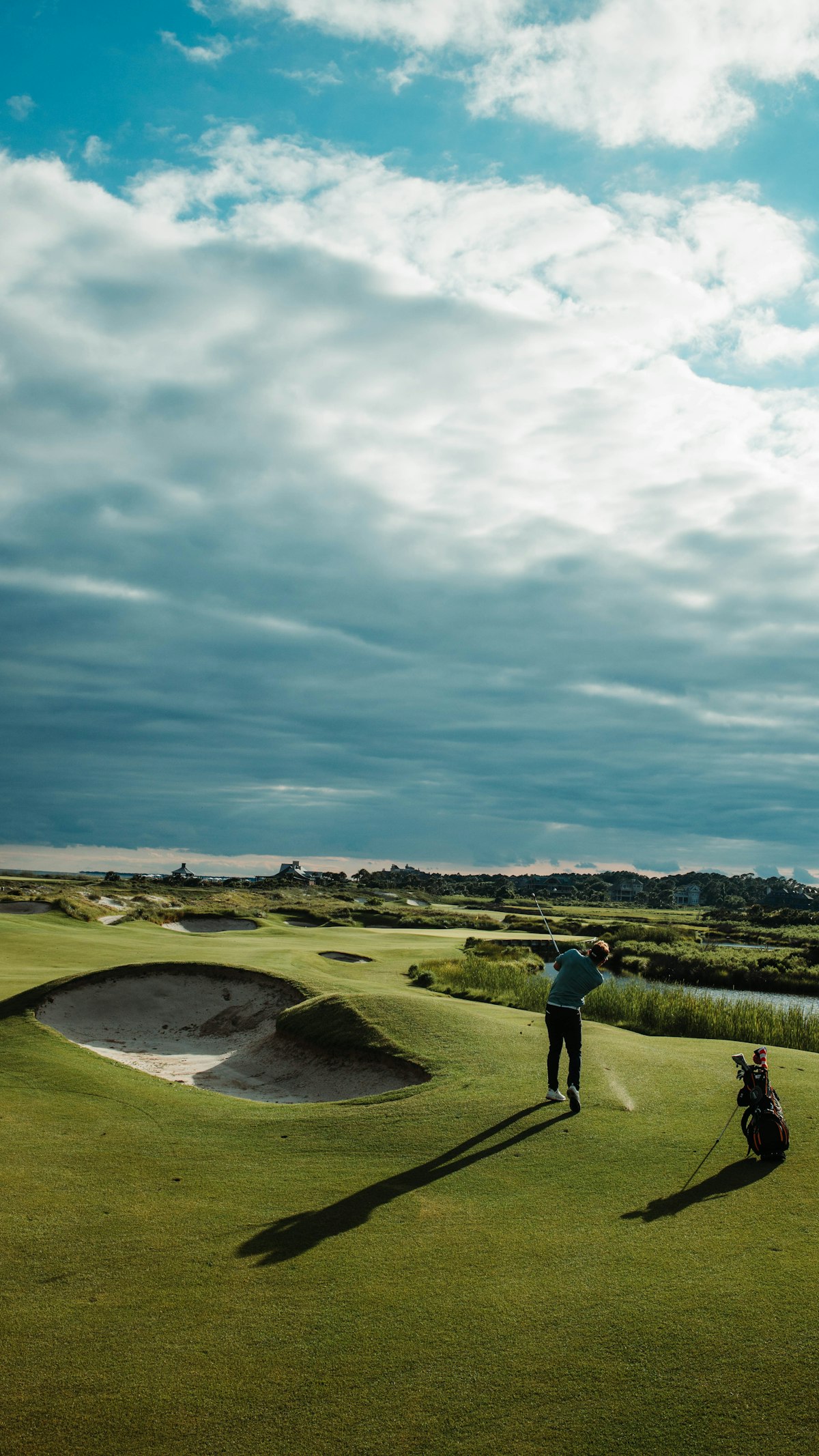 Golfer playing a shot on a links course
